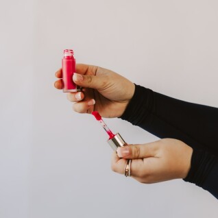 woman having makeup applied